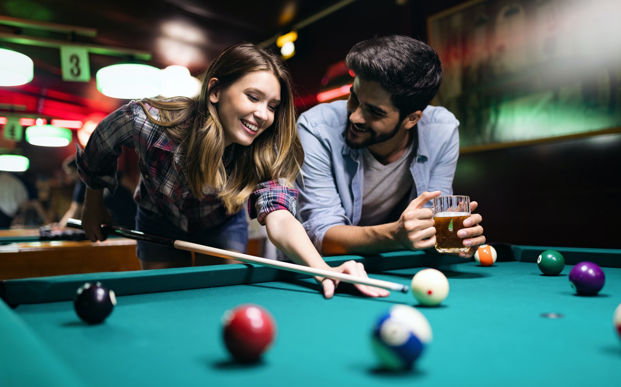 couple-dating-flirting-and-playing-billiard-in-a-pub.jpg